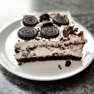 This Heavenly Oreo Dessert is a chocolate lover's dream come true! With layers of creamy filling and crushed Oreos, this no-bake treat is as easy as it is delicious. Perfect for parties, potlucks, or a cozy night in. Save this recipe to impress your friends and family with a delightful dessert they'll never forget!