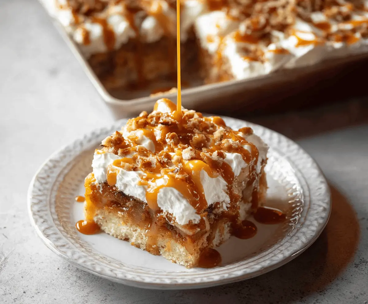 Delicious Caramel Apple Poke Cake topped with caramel drizzle and apple slices, perfect for fall dessert