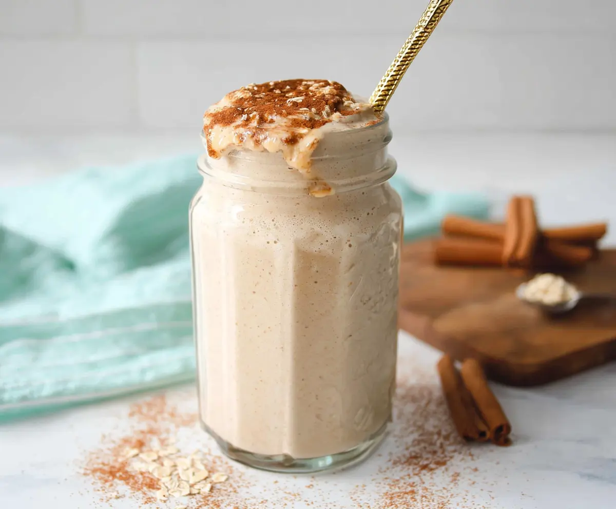 Delicious Cinnamon Roll Protein Shake with swirls of cinnamon and creamy texture.
