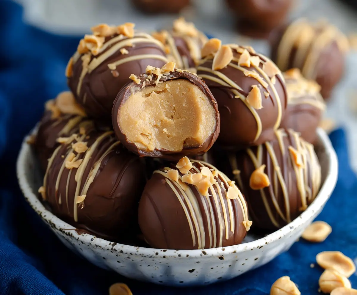 Delicious homemade peanut butter balls coated in chocolate for a sweet treat.