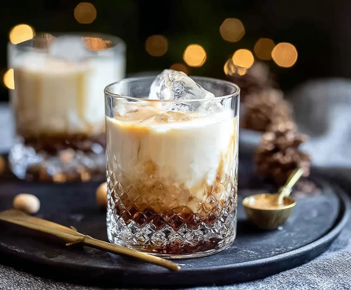 Delicious Peanut Butter White Russian Christmas Cocktail garnished with festive decorations.