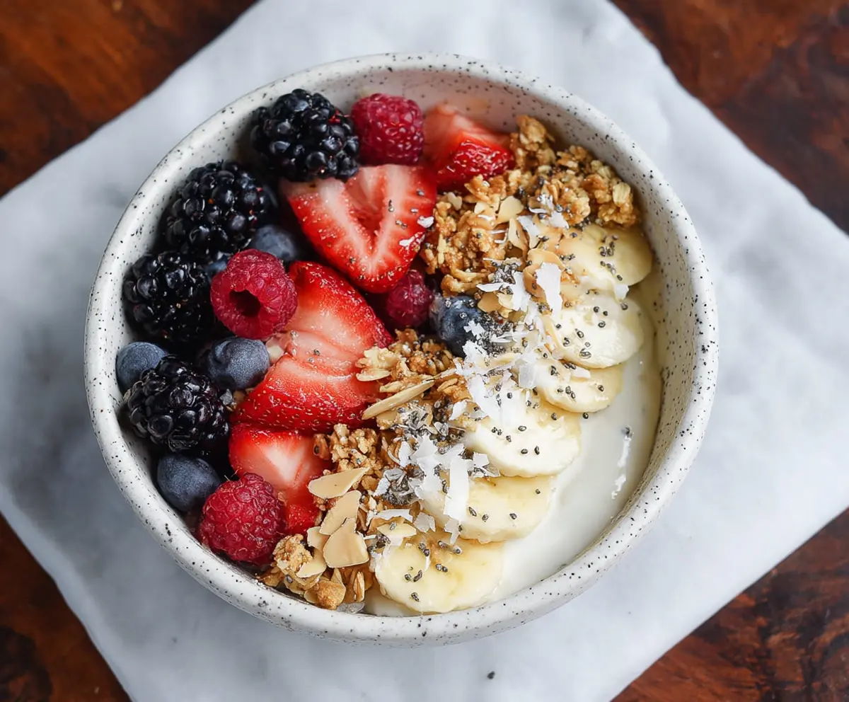 Healthy Protein Yogurt Bowl topped with fresh berries and granola for a nutritious breakfast.
