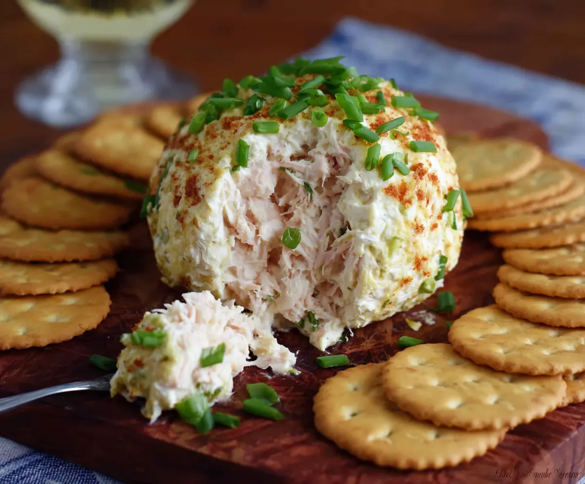 Creamy crab dip cheese ball served as a delicious appetizer for parties.