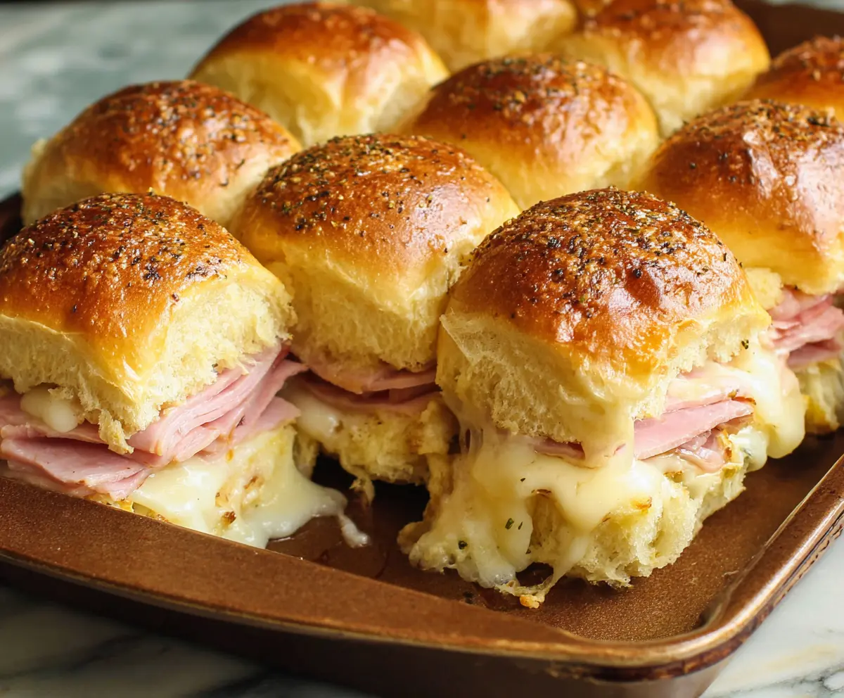 Delicious Ham and Cheese Hawaiian Roll Sliders fresh out of the oven, perfect for entertaining or snack time.