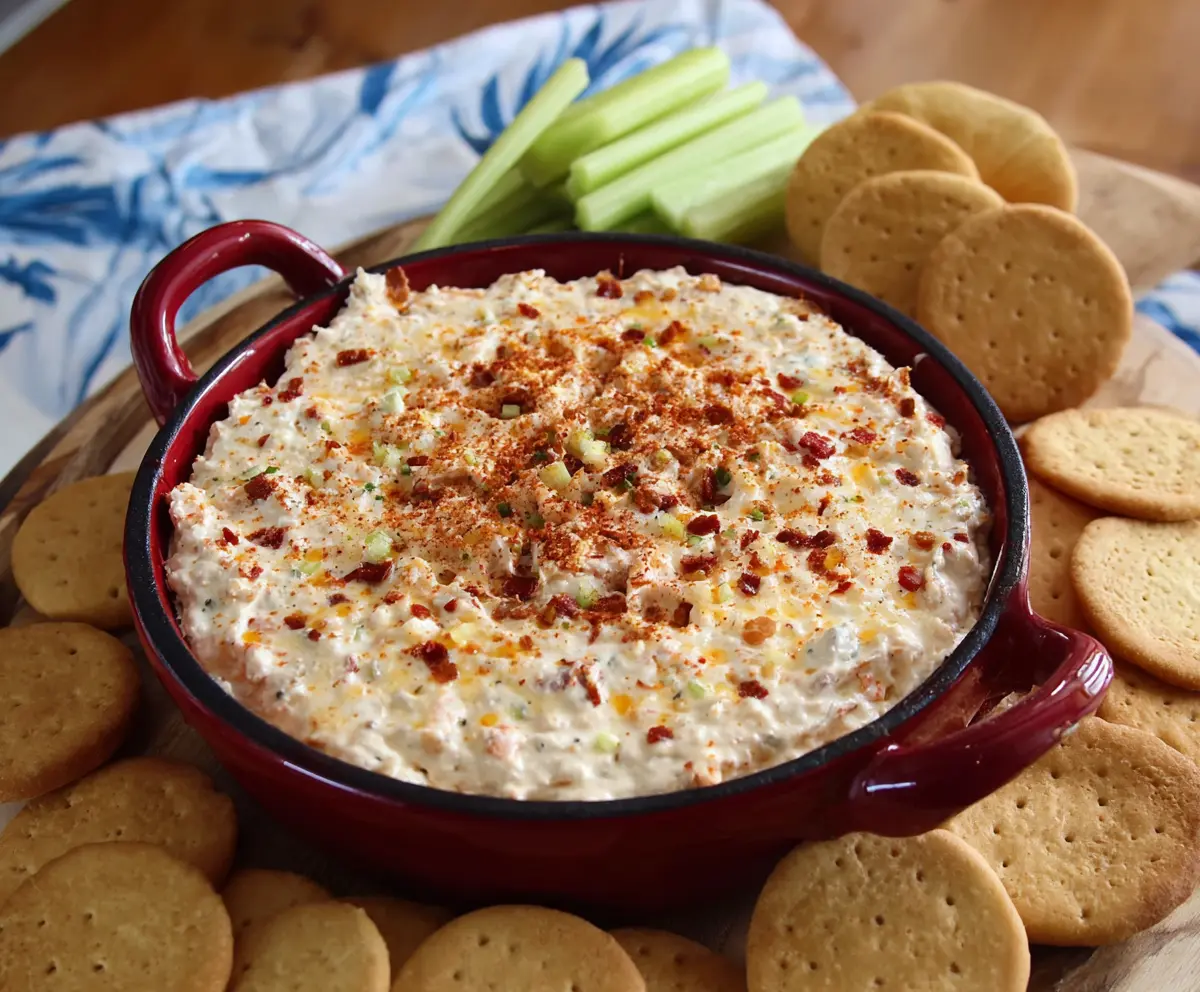 Spicy Alabama Fire Cracker Dip with creamy cheese and hot peppers in a serving bowl.