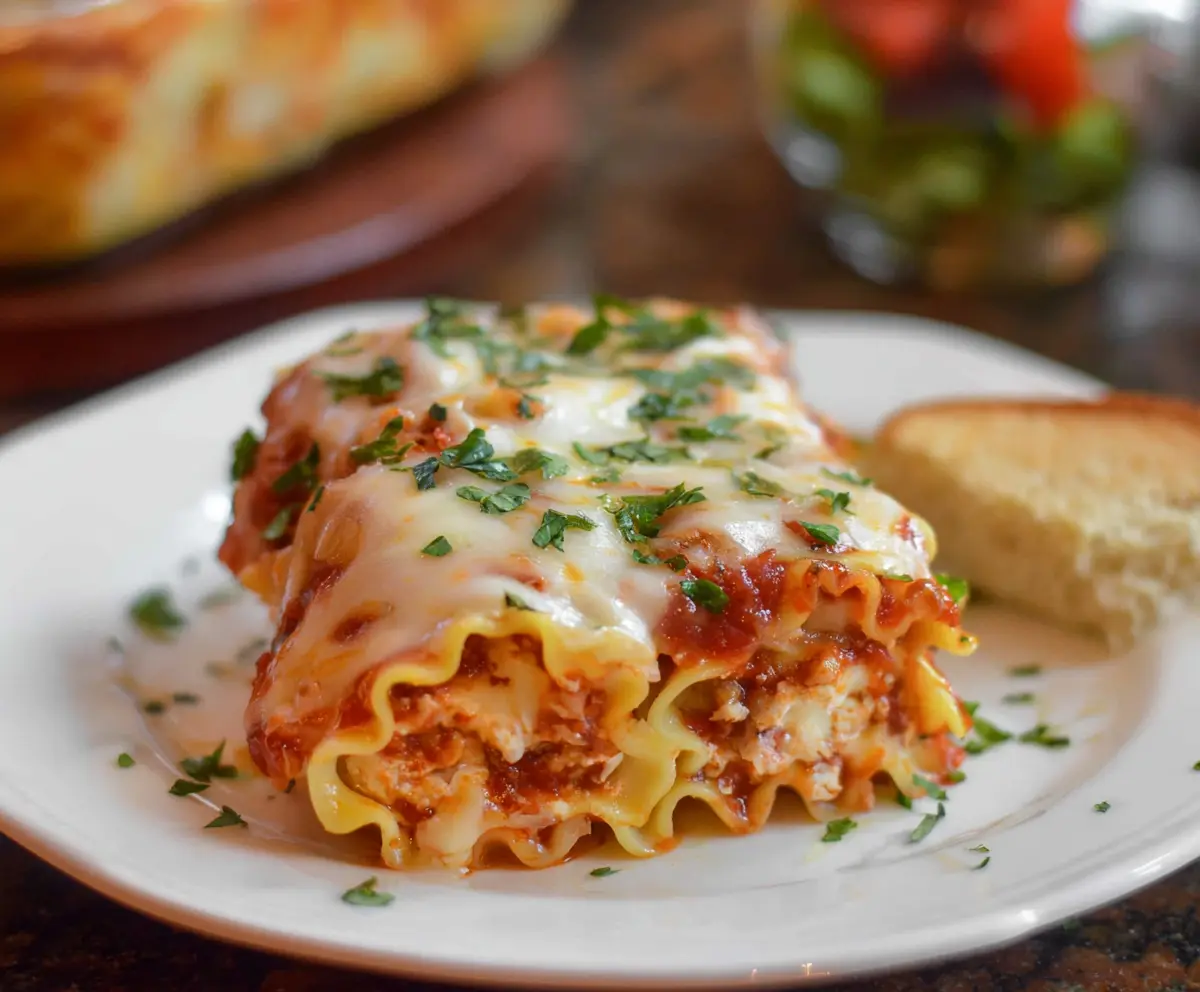 Delicious homemade lasagna roll ups with cheesy and savory filling served on a plate.